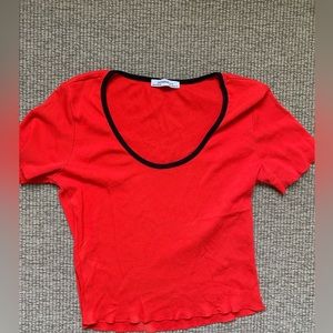 Cropped red scoop neck T-shirt with black trim